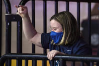 Villanova team manager Rachel Grace cheers to her team at the end of an NCAA college college basketball game against DePaul in the quarterfinals of the Big East Conference tournament at Mohegan Sun Arena, Saturday, March 6, 2021, in Uncasville, Conn. A small group of family and friends were allowed to watch the tournament. (AP Photo/Jessica Hill)