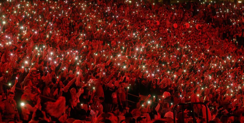 Fans bask in the red light from the new lighting system in Bryant-Denny Stadium during the Crimson Tide's 35-13 victory in Bryant-Denny Stadium Saturday, Oct. 19, 2019. [Staff Photo/Gary Cosby Jr.]