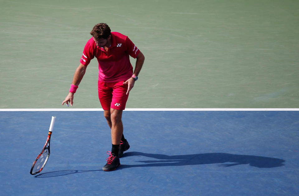 Stan Wawrinka throws down his racket during the U.S. Open in New York