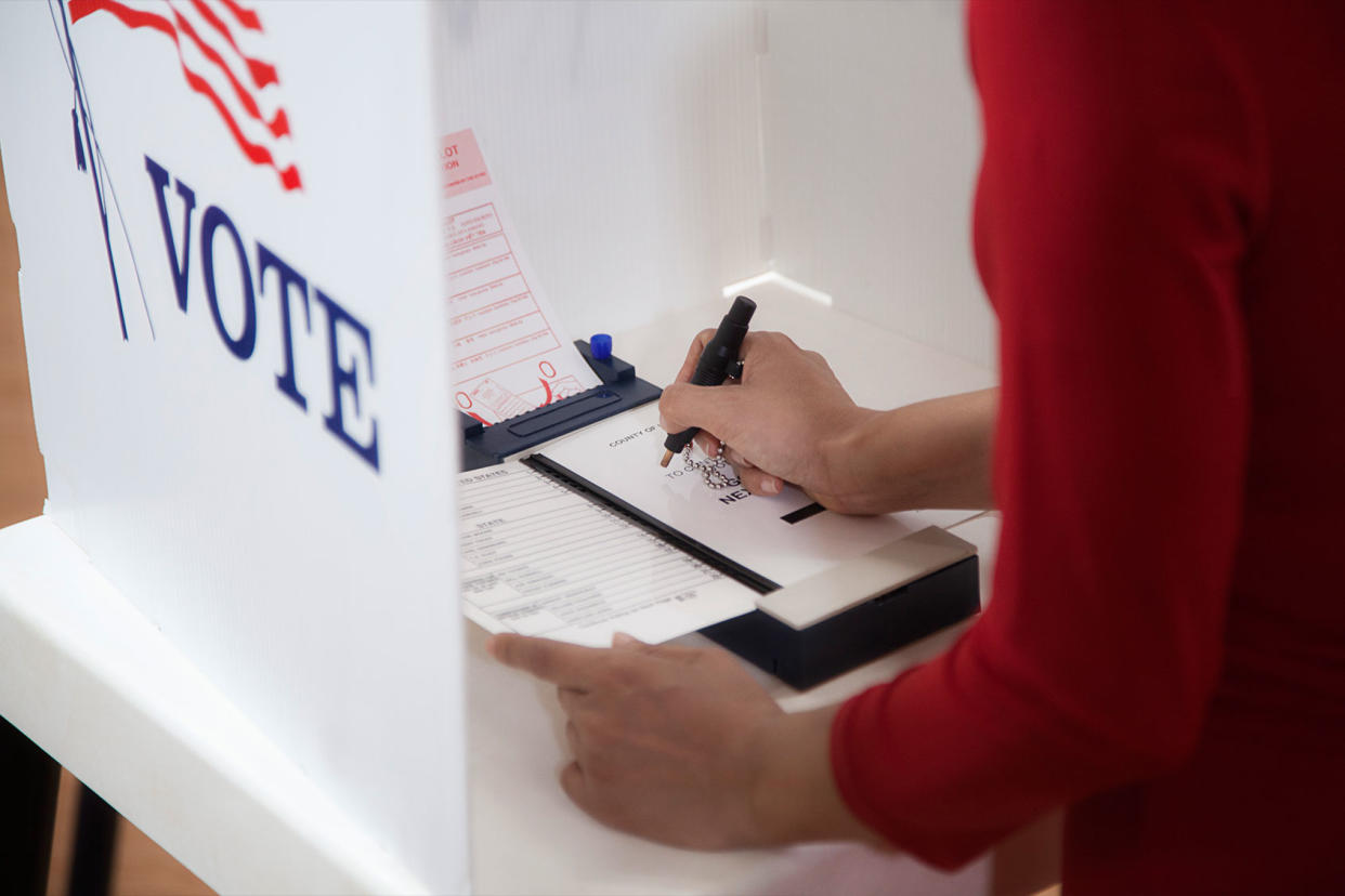 Voter voting in a polling place Getty Images/Hill Street Studios