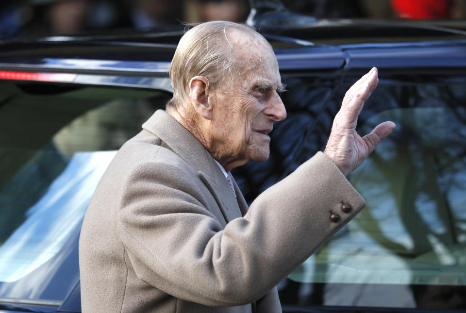 FILE - In this Sunday, Dec. 25, 2016 file photo, Britain's Prince Philip waves to the public as he leaves after attending a Christmas day church service in Sandringham, England. Buckingham Palace says Prince Philip the husband of Queen Elizabeth II had been in a traffic accident and is not injured. The palace said the accident happened Thursday, Jan. 17, 2019 afternoon near the queen’s country residence in Sandringham in eastern England. (AP Photo/Kirsty Wigglesworth, file)