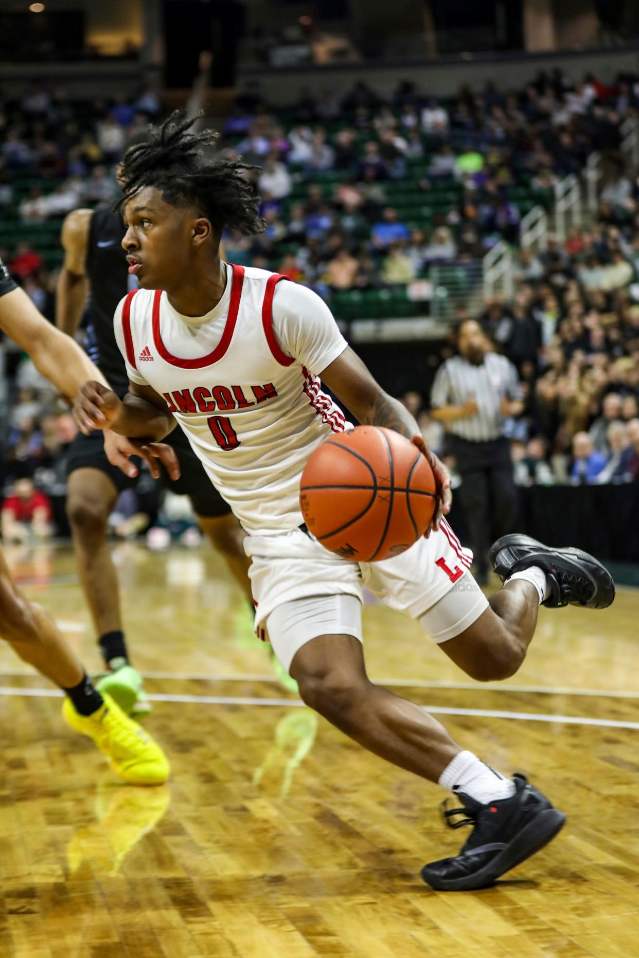 Warren Lincoln’s Moses Blackwell drives the lane against Grand Rapids Christian during the MHSAA boys basketball Division 2 final at Breslin Center in East Lansing on Saturday, March 16, 2024.