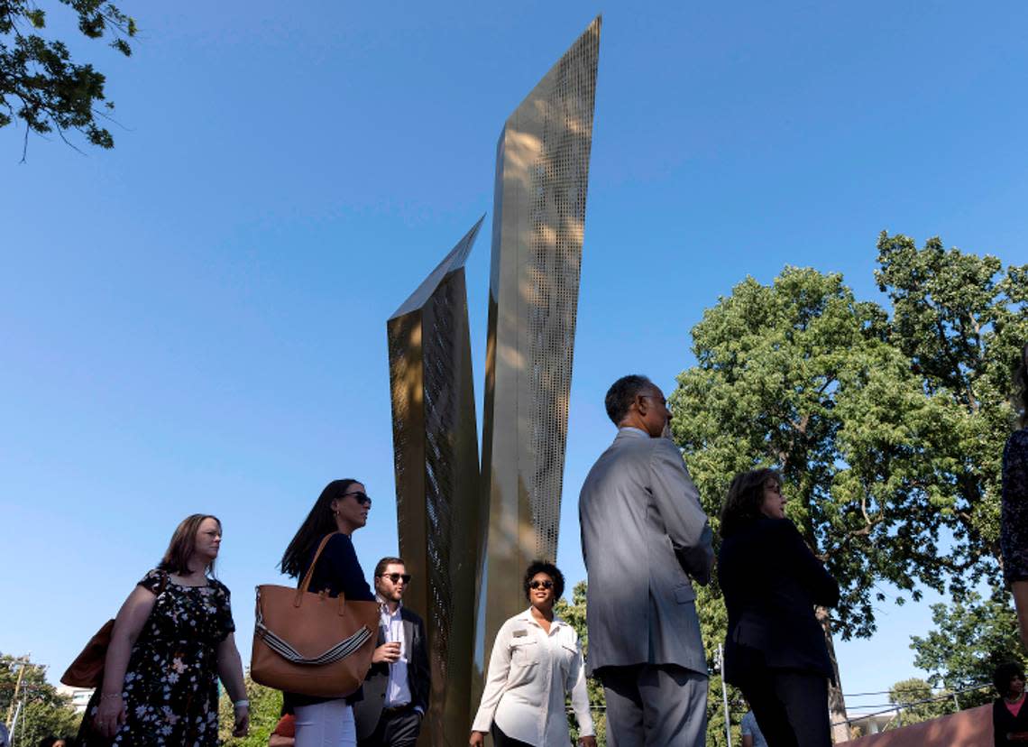 Visitors walk past the Beacon of Freedom at North Carolina Freedom Park prior to a ceremony marking the park’s opening on Wednesday, Aug. 23, 2023, in Raleigh, N.C. The park honors the African American struggle for freedom.