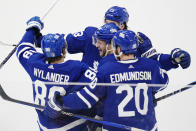 Toronto Maple Leafs' William Nylander (88) celebrates after his goal against the Boston Bruins with Morgan Rielly (44), Matthew Knies (23) and Joel Edmundson (20) during third-period action in Game 6 of an NHL hockey Stanley Cup first-round playoff series in Toronto, Thursday, May 2, 2024. (Frank Gunn/The Canadian Press via AP)