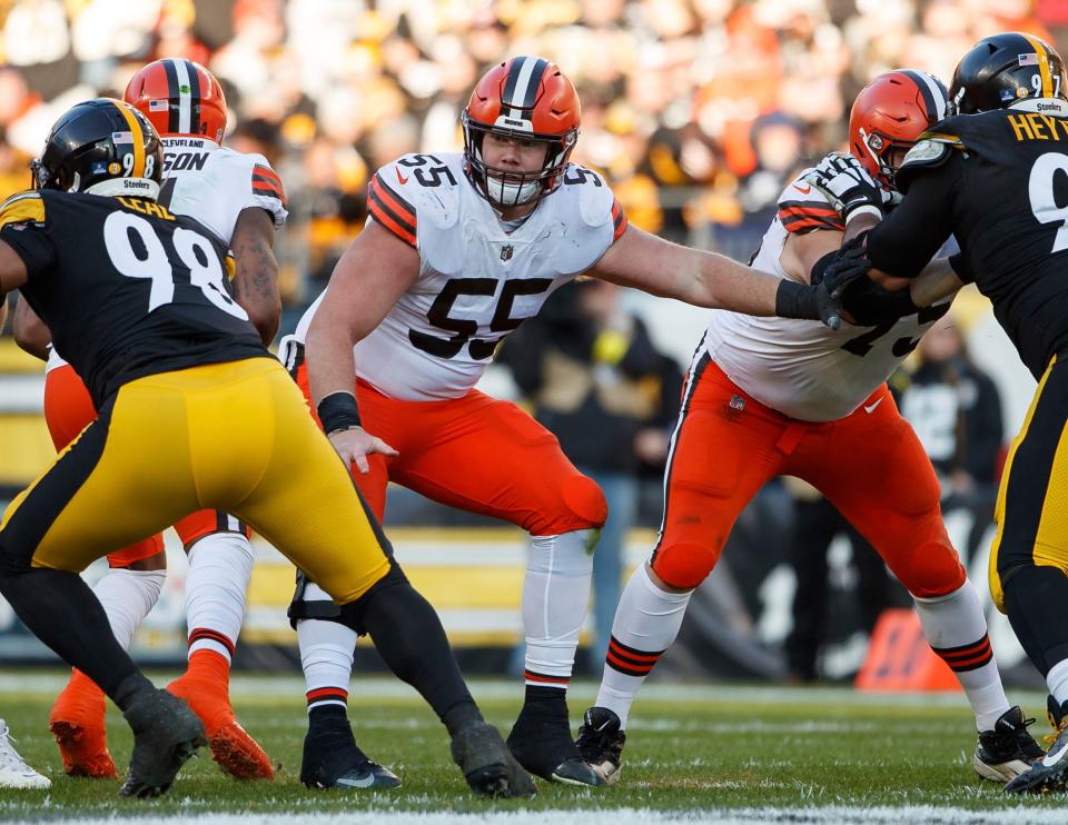 FILE - Cleveland Browns center Ethan Pocic (55) blocks during an NFL football game against the Pittsburgh Steelers, Jan. 8, 2023, in Pittsburgh. The Browns agreed to a new contract with Pocic, Monday, March 13, 2023. He had a strong 2022 season for the Browns, who were forced to scramble at center after releasing JC Tretter and when projected starter Nick Harris suffered a season-ending injury in the exhibition opener. (AP Photo/Matt Durisko, File)