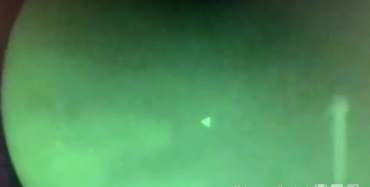 <p>A video showing pyramid shaped objects hovering above a US navy destroyer</p> (Screengrab/@JeremyCorbell)