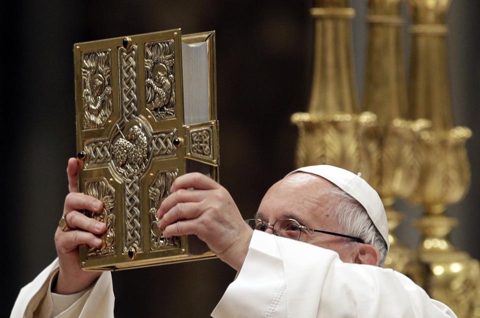 Pope Francis presides over a solemn Easter vigil ceremony in St. Peter's Basilica at the Vatican, Saturday, April 15, 2017. (AP Photo/Andrew Medichini)