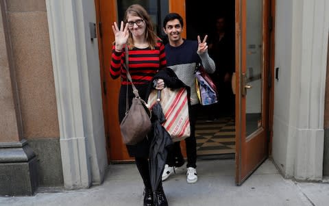 Laid-off WeWork employees exit WeWork corporate headquarters in Manhattan, New York - Credit: Mike Segar/Reuters