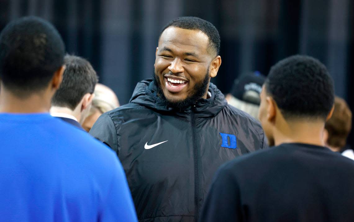 Duke’s DeWayne Carter laughs with others after a press conference where was Manny Diaz introduced as Duke football’s new head coach Saturday, Dec. 9, 2023.