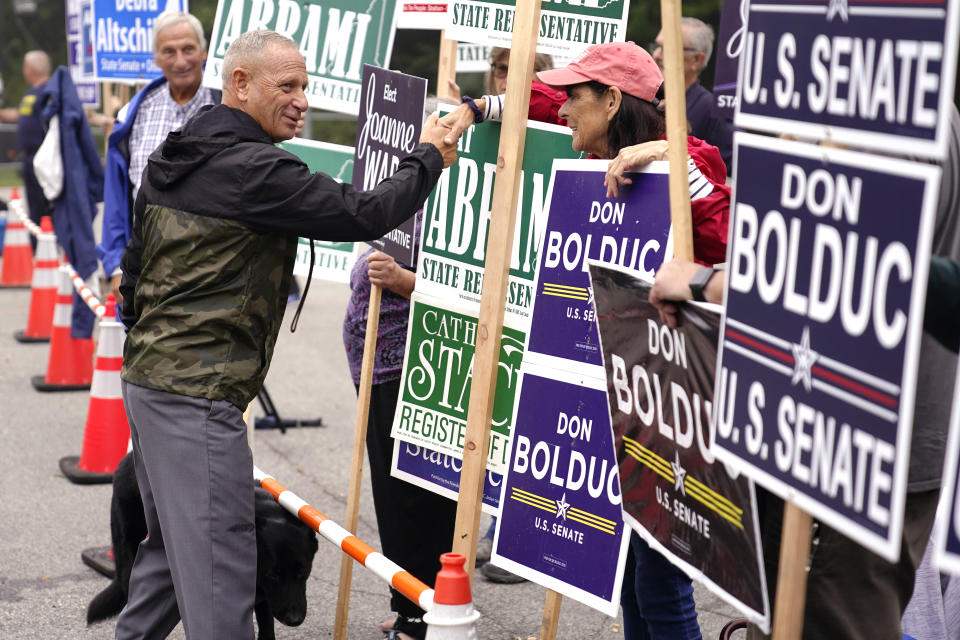 New Hampshire Republican U.S. Senate candidate Don Bolduc, shakes hands with campaign volunteers after voting, Tuesday, Sept. 13, 2022, in Stratham, N.H. Bolduc faces incumbent Sen. Maggie Hassan, D-N.H., in the general election. (AP Photo/Charles Krupa, File)