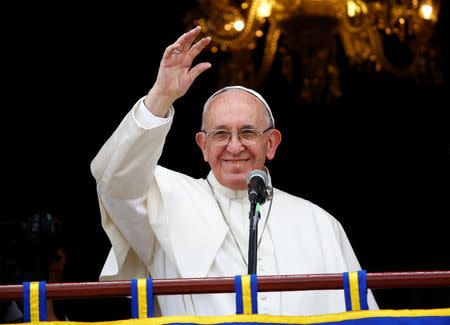 Pope Francis addresses the audience from the balcony of the Cardinal Palace in Bogota, Colombia September 7, 2017. REUTERS/Stefano Rellandini