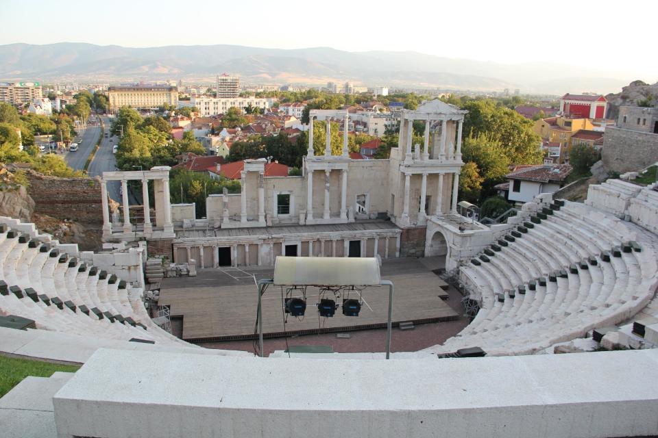 This Aug. 21, 2012 photo shows the ancient Roman theater in Plovdiv, Bulgaria. A visit to Bulgaria can alternately feel like taking like a step back in time and witnessing a society that has modernized at warp speed. Mules and Ferraris share the freeways. Near a store selling Prada and Versace clothes, old women peddle handmade crocheted doilies and embroidered tablecloths. Dilapidated Soviet-style apartment buildings teem with people, as does a sparkling new shopping mall. (AP Photo/Coralie Carlson)