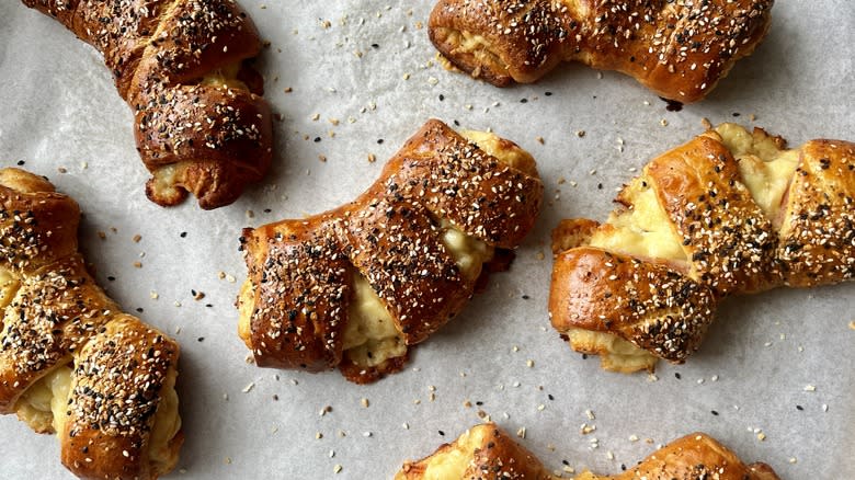 ham and cheese bear claws on a baking sheet