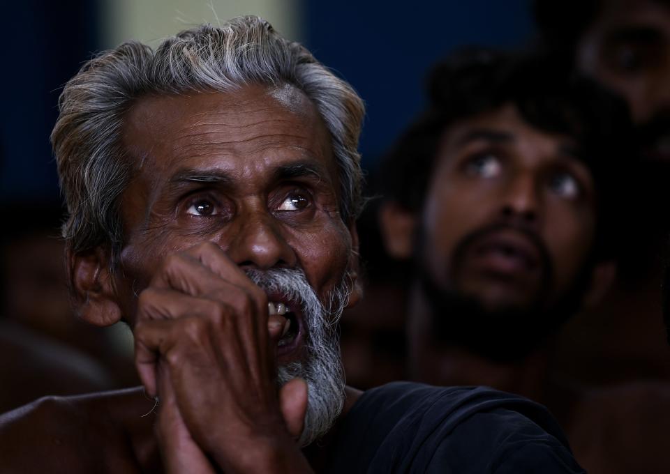 Bangladeshi migrant waits at the Police headquarters in Langkawi on May 11, 2015 after landing on Malaysian shores earlier in the day. (MANAN VATSYAYANA/AFP/Getty Images)