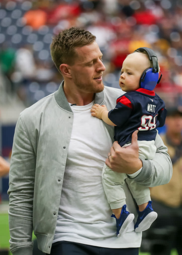 HOUSTON, TX - OCTOBER 01:  Former Houston Texans defensive end J.J. Watt and son Koa James walk past the sidelines during the NFL game between the Pittsburgh Steelers and Houston Texans on October 1, 2023 at NRG Stadium in Houston, Texas.  (Photo by Leslie Plaza Johnson/Icon Sportswire via Getty Images)