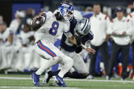 New York Giants quarterback Daniel Jones (8) is sacked by Dallas Cowboys safety Donovan Wilson (6) during the fourth quarter of an NFL football game, Monday, Sept. 26, 2022, in East Rutherford, N.J. (AP Photo/Adam Hunger)