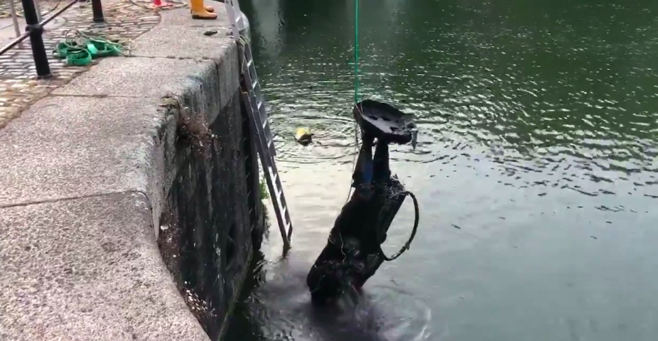 The statue of slave trader Edward Colston being removed from the harbour where it was dumped by anti-racism protesters on Sunday. (Twitter/Bristol City Council)