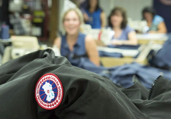 Canada Goose employees work at the clothing company's new factory in Toronto Oct. 15, 2014. (CP)