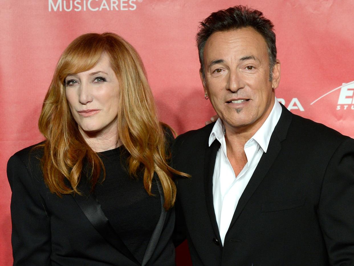 Bruce Springsteen (R) and singer Patti Scialfa arrive at he 2013 MusiCares Person Of The Year Gala Honoring Bruce Springsteen at Los Angeles Convention Center on February 8, 2013 in Los Angeles, California