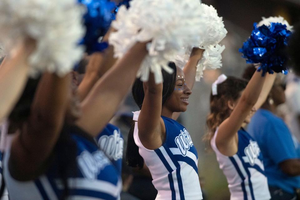 The Washington High School sidelines come alive with team spirit during the team's season opener against Pensacola High School on Friday, Aug. 25, 2023.