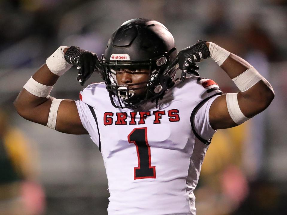 Buchtel linebacker Jermaine James flexes after sacking Firestone quarterback Daylyn Taylor on third down during the first half of a high school football game, Friday, Oct. 21, 2022, in Akron, Ohio.