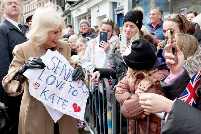 <p>Chris Jackson/Pool/Getty</p> Queen Camilla receives well wishes for Kate Middleton at the Shrewsbury Farmers' Market on March 27, 2024.