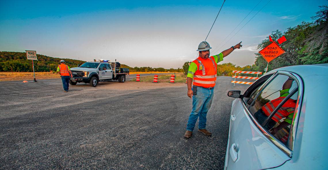 Somervell County workers turned motorists around on FM 205 in Glen Rose because of the Chalk Mountain fire on Wednesday, July 20, 2022.