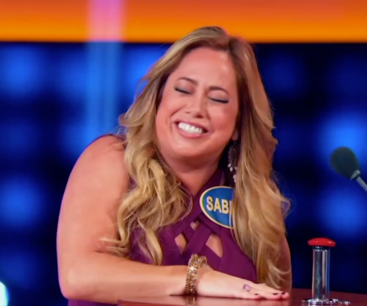Sabrina Bryan reacts to being serenaded by Nathan Morris of Boyz ll Men on <em>Celebrity Family Feud</em>. (Photo: ABC)