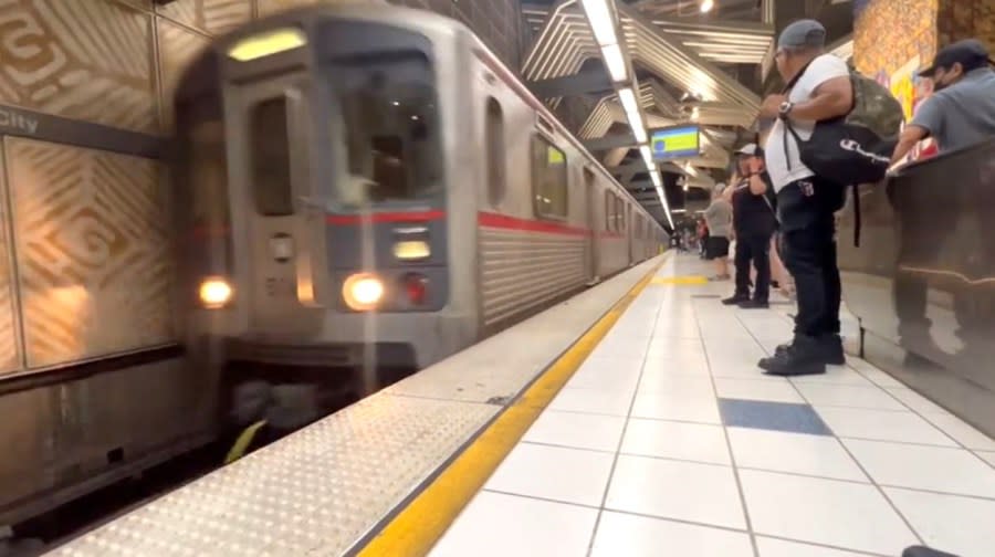 Riders wait for a subway ride at the Universal City/Studio City Metro Station. (KTLA)