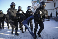 Police detain a man during a protest against the jailing of opposition leader Alexei Navalny in Siberian city of Omsk, Russia, on Sunday, Jan. 31, 2021. Thousands of people took to the streets Sunday across Russia to demand the release of jailed opposition leader Alexei Navalny, keeping up the wave of nationwide protests that have rattled the Kremlin. Hundreds were detained by police. (AP Photo)