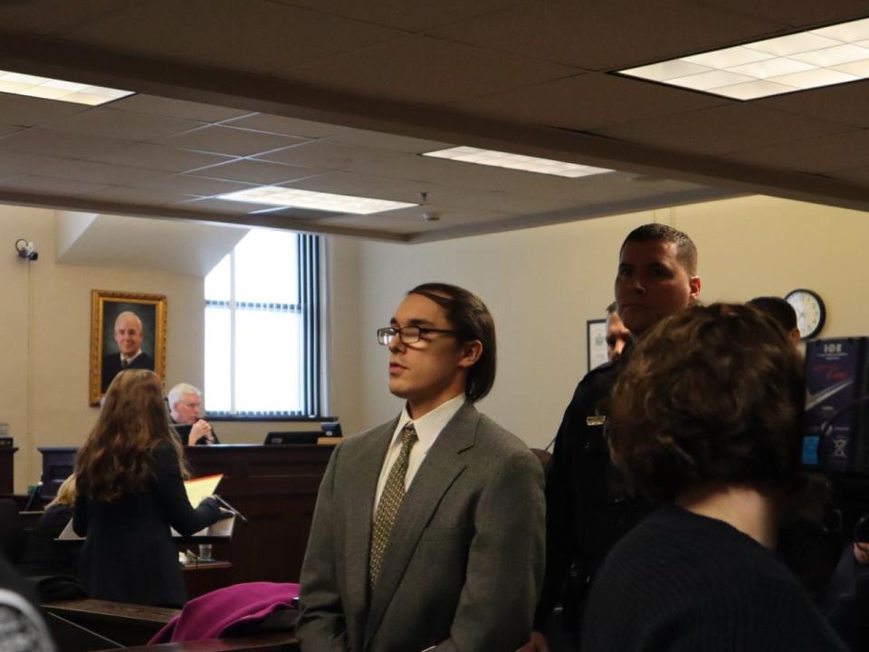 Brandon Clark, dressed in a gray suit rather than his usual orange jumpsuit, leaves the courtroom Monday, Feb. 10, 2020, in Oneida County Court after pleading guilty to the murder of Bianca Devins.