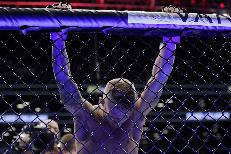 TJ Dillashaw reacts after losing a flyweight mixed martial arts championship bout against Henry Cejudo at UFC Fight Night early Sunday, Jan. 20, 2019, in New York. Cejudo stopped Dillashaw in the first round. (AP Photo/Frank Franklin II)