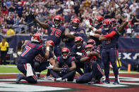Houston Texans quarterback C.J. Stroud (7) pretends to take a picture as the team celebrates a touchdown scored by Devin Singletary in the first half of an NFL football game in Houston, Sunday, Nov. 19, 2023. (AP Photo/Eric Christian Smith)