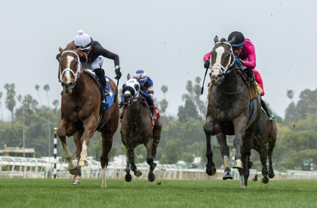 In a photo provided by Benoit Photo, The Chosen Vron and jockey Hector I. Berrios, left, battle Indian Peak, with Juan Hernadez, as The Chosen Vron goes on to win the $100,000 Sensational Star Stakes horse race Sunday, March 19, 2023, at Santa Anita in Arcadia, Calif. (Benoit Photo via AP)