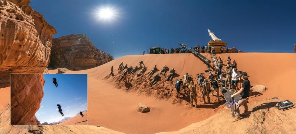 The cast and crew filming Dune: Part Two in the orange dessert sand from The Art and Soul of Dune: Part Two