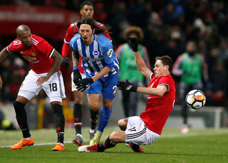 Soccer Football - FA Cup Quarter Final - Manchester United vs Brighton & Hove Albion - Old Trafford, Manchester, Britain - March 17, 2018 Manchester United's Nemanja Matic in action with Brighton’s Ezequiel Schelotto REUTERS/Andrew Yates