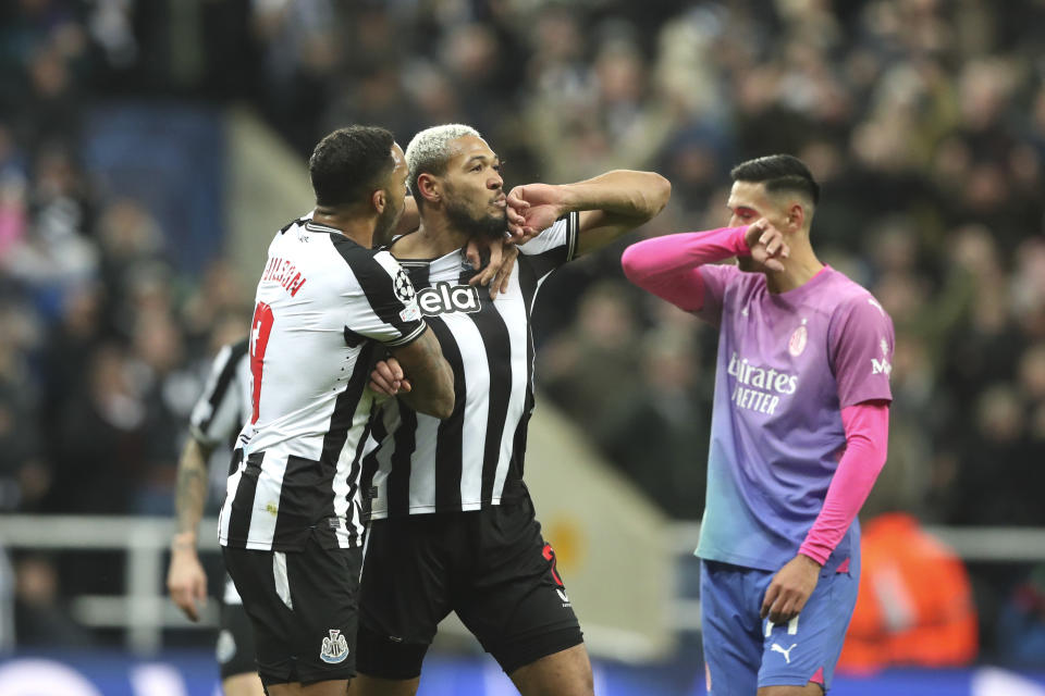 Newcastle's Joelinton, center, celebrates after scoring the opening goal during the Champions League group F soccer match between Newcastle United and AC Milan at St. James' Park, in Newcastle, England, Wednesday, Dec. 13, 2023. (AP Photo/Scott Heppell)