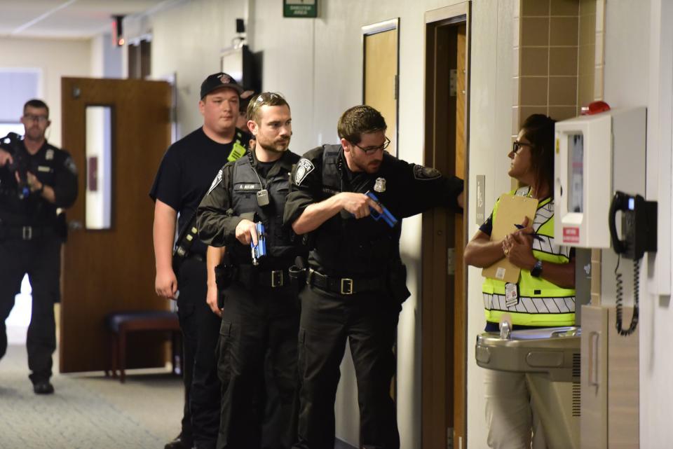 Port Huron Police Department officers clear a room for an active shooter during the active killer training on the campus of St. Clair County Community College in Port Huron on Tuesday, August 9, 2022.