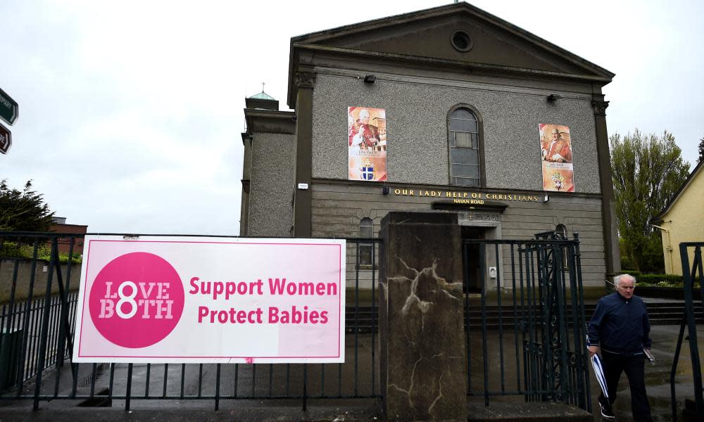 A church with a poster supporting the yes campaign on its railings