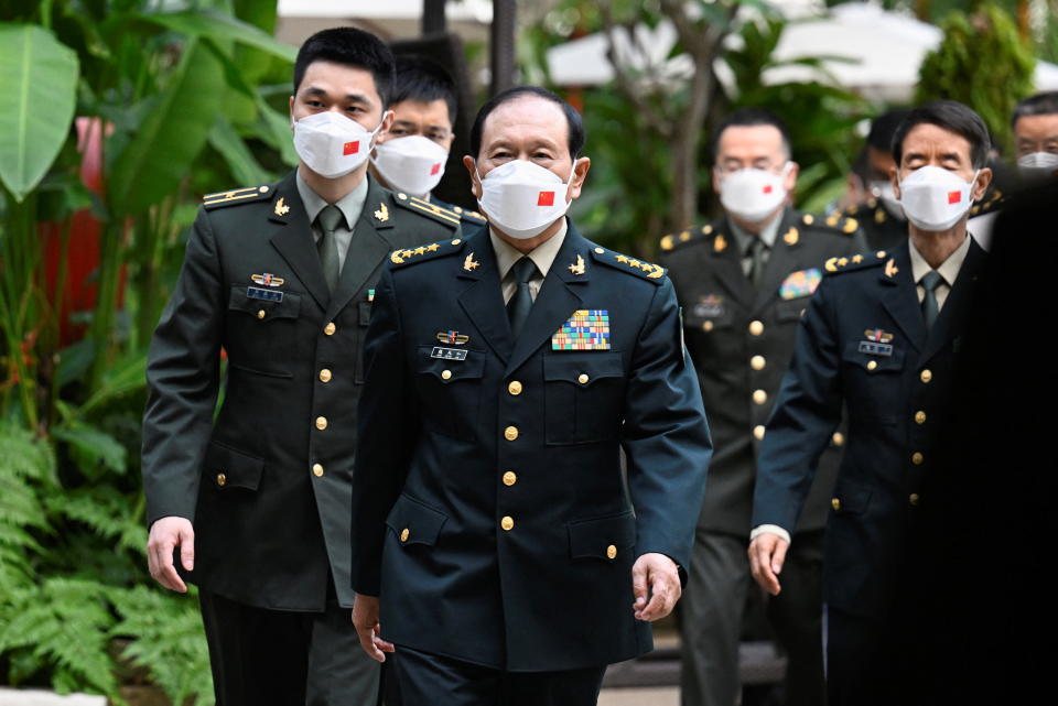 China's State Councilor and Defence Minister General Wei Fenghe walks to attend a bilateral meeting with US Defence Secretary Lloyd Austin. 