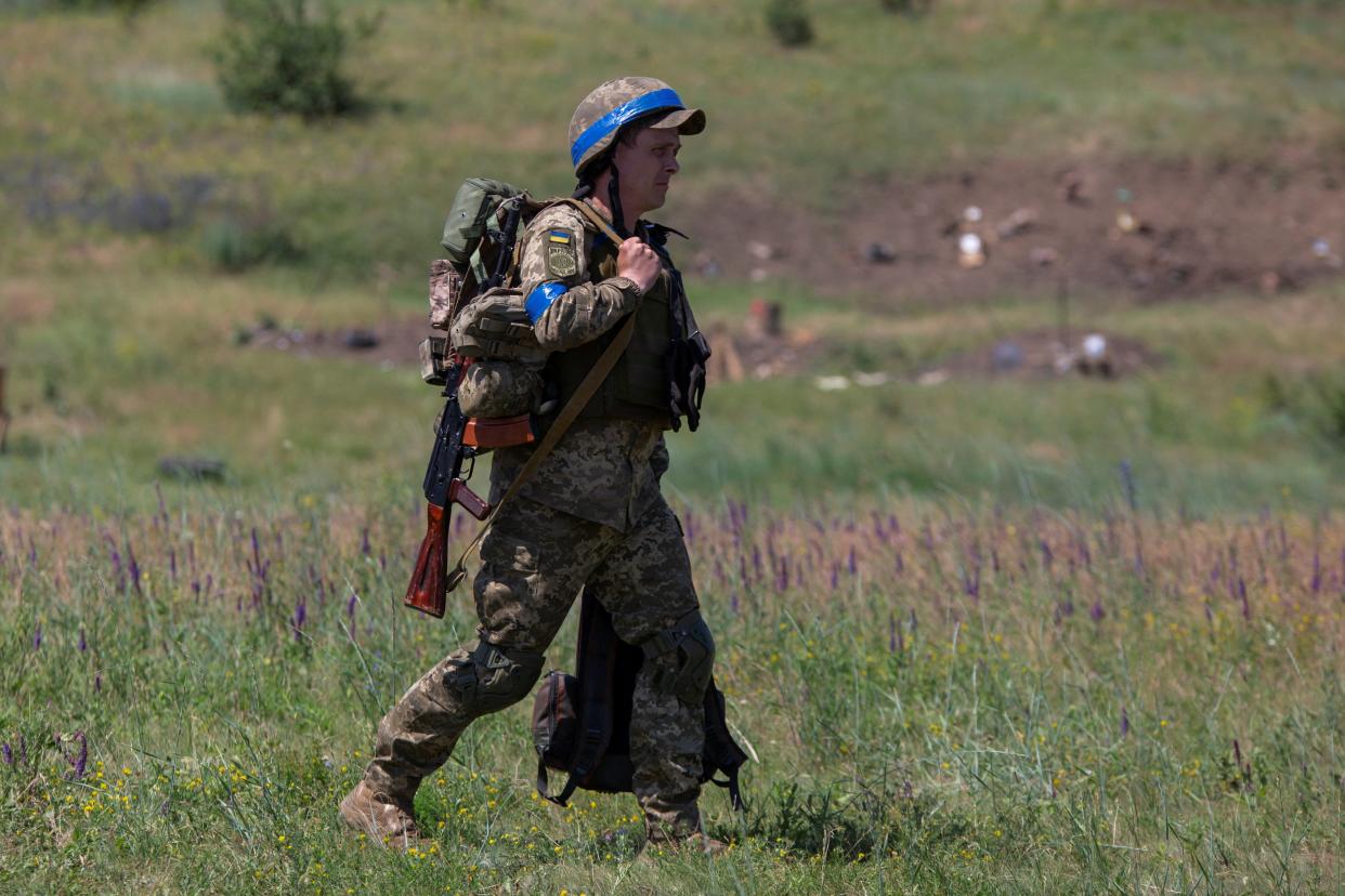 A Ukrainian service member walks at a training ground near a frontline, amid Russia's attack on Ukraine, in Donetsk region (REUTERS)