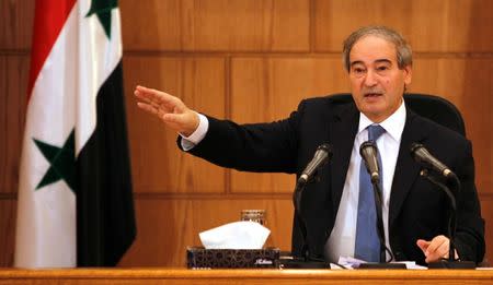 Syrian Deputy Foreign Minister Faisal Mekdad gestures during a news conference in Damascus, Syria July 3, 2017. REUTERS/Omar Sanadiki