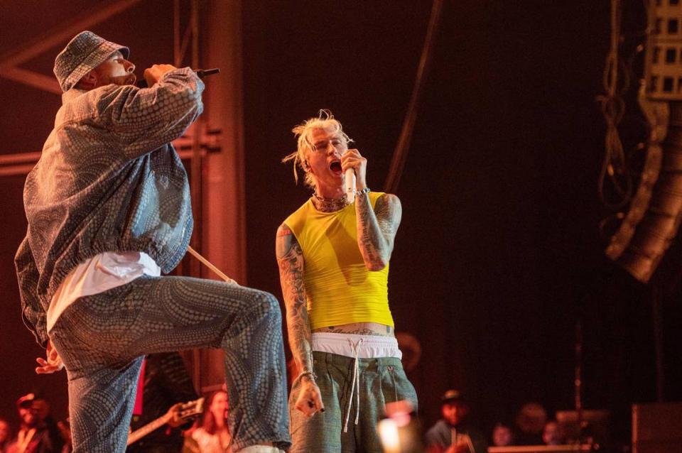 Travis Kelce, left, and Machine Gun Kelly rock out to the Beastie Boys, “Fight For Your Right,” at Kelce Jam at the Azura Amphitheater on Friday, April 28, 2023, in Bonner Springs.