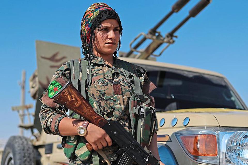 On alert: a YPJ fighter in Shadadi, Syria. The women's militia was key to defeating IS: Getty Images