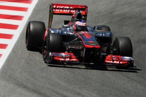 McLaren's Jenson Button whizzes around the Circuit de Catalunya. Button and McLaren laid down an early marker on Friday when the Englishman topped the times in opening practice for Sunday's Spanish Grand Prix as drivers sweated over tyres for the race