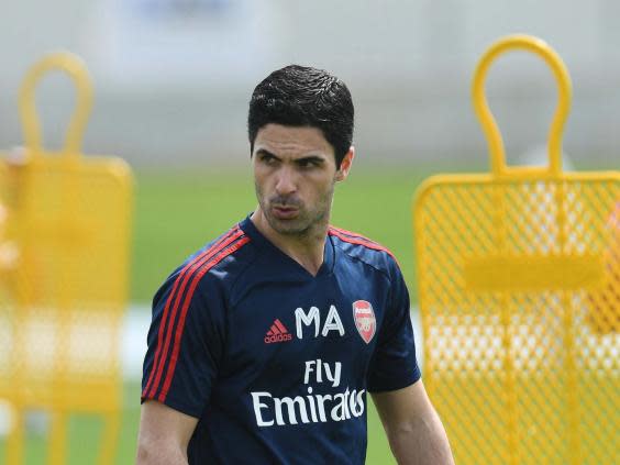 Arsenal coach Mikel Arteta explained to Lacazette why he had been dropped (Arsenal FC via Getty Images)