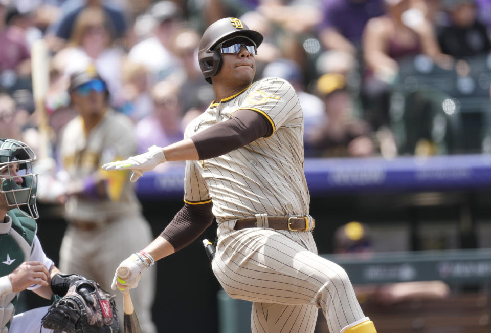 San Diego Padres' Juan Soto follows the flight of his two-run home run against Colorado Rockies starting pitcher Kyle Freeland in the third inning of a baseball game, Wednesday, Aug. 2, 2023, in Denver. (AP Photo/David Zalubowski)