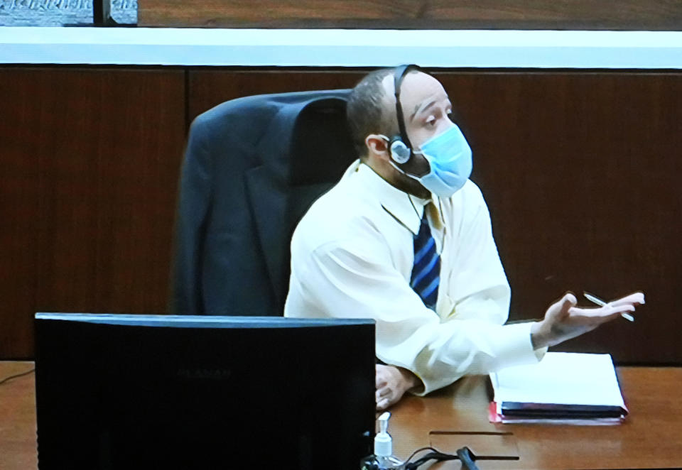 Darrell Brooks appears via video from an adjacent courtroom due to his continuous interruptions during his trial in a Waukesha County Circuit Court in Waukesha, Wis., on Monday, Oct. 24, 2022. Brooks, who is representing himself during the trial, is charged with driving into a Waukesha Christmas Parade last year, killing six people and injuring dozens more. (Mike De Sisti/Milwaukee Journal-Sentinel via AP, Pool)