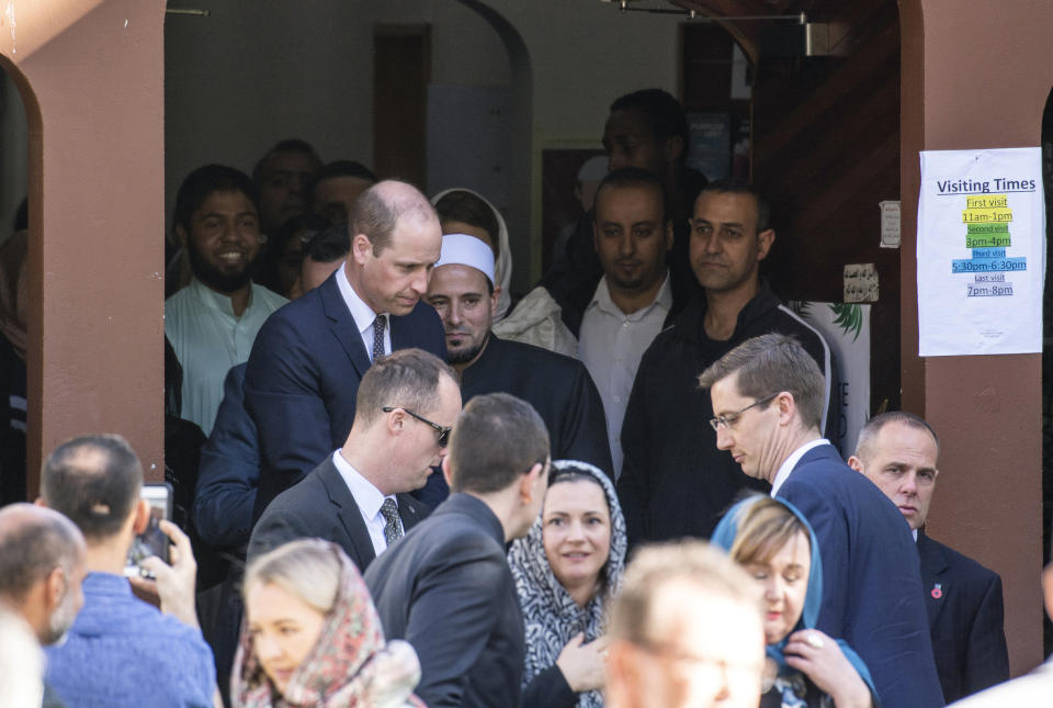 Britain's Prince William, center left, acknowledges the crowd after visiting the Al Noor mosque, one of the mosques in the mass shooting, in Christchurch, New Zealand, Friday, April 26, 2019. Prince William visited one of the two Christchurch mosques where 50 people were killed and 50 others wounded in a March 15 attack by a white supremacist. (David Alexander/SNPA via AP)