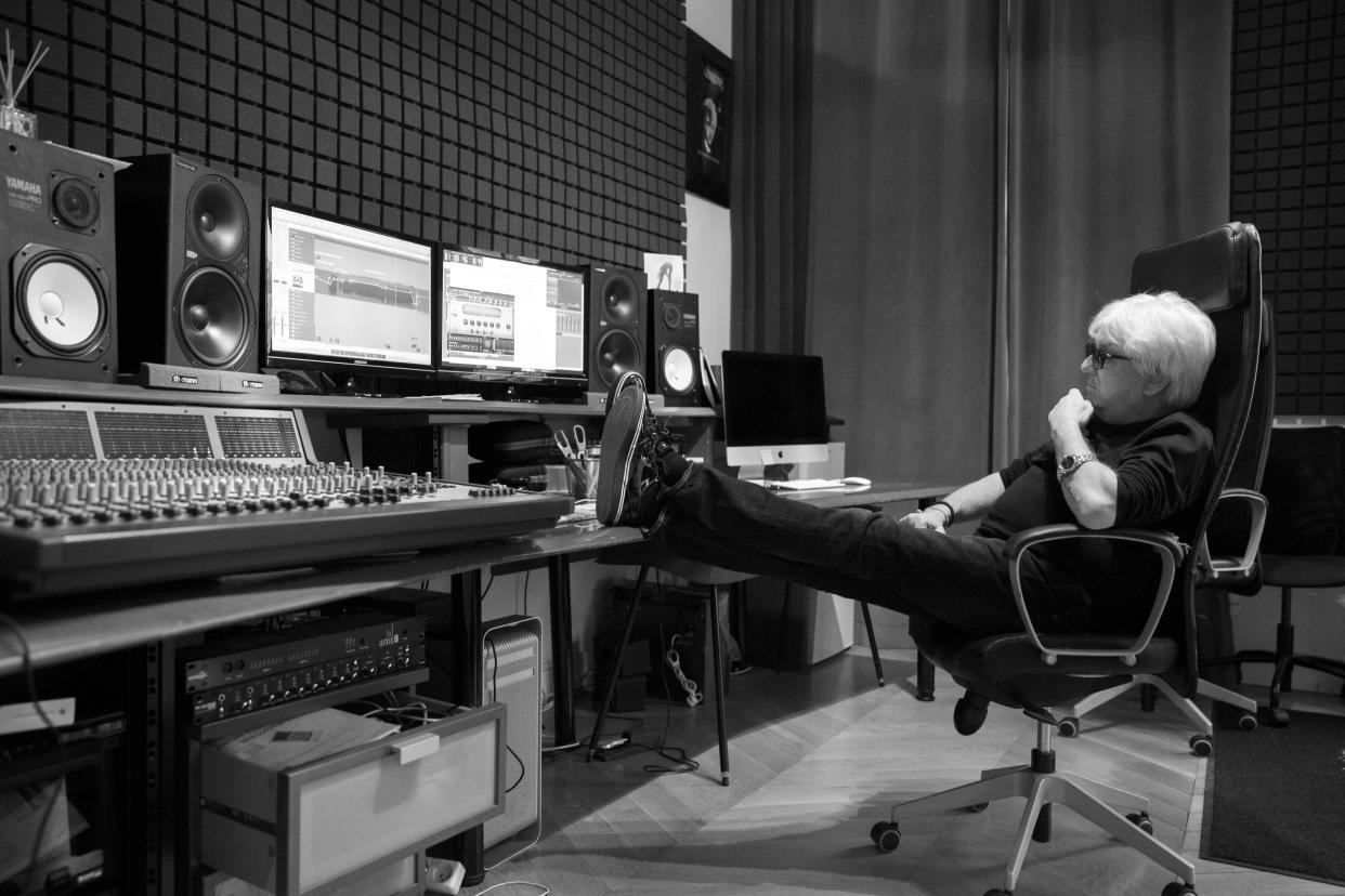 Black and white picture of Marc Cerrone working in his studio